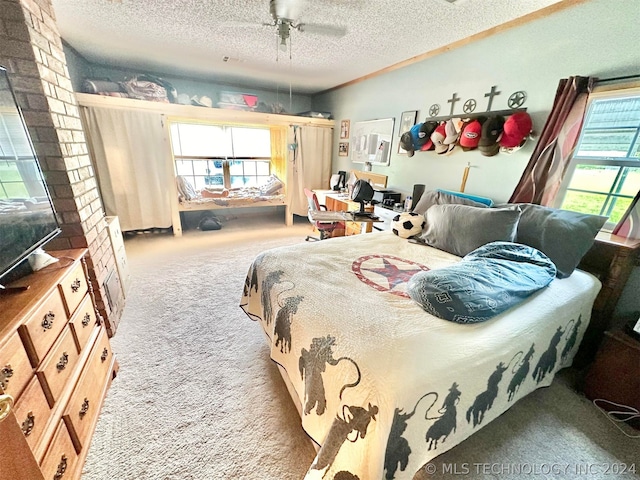 bedroom with brick wall, a textured ceiling, carpet flooring, and ceiling fan