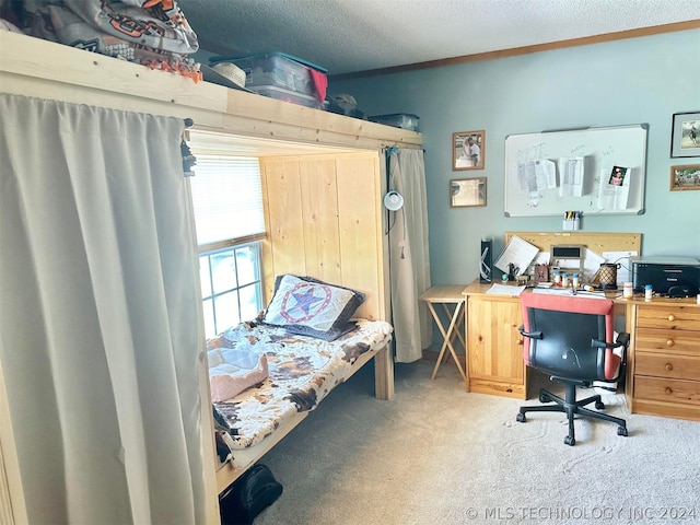 carpeted bedroom with a textured ceiling