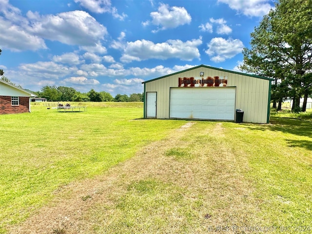 garage featuring a yard