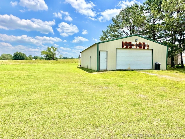 exterior space featuring a garage and an outdoor structure