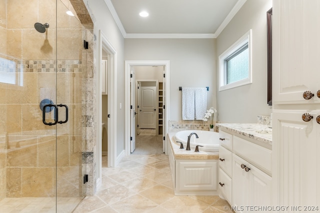 bathroom with tile flooring, vanity, ornamental molding, and independent shower and bath