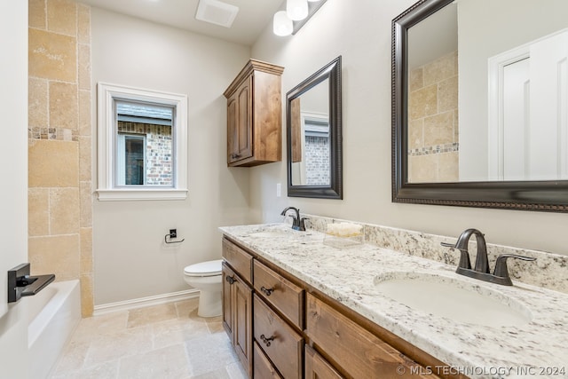 full bathroom featuring tile floors, tiled shower / bath combo, toilet, and dual bowl vanity