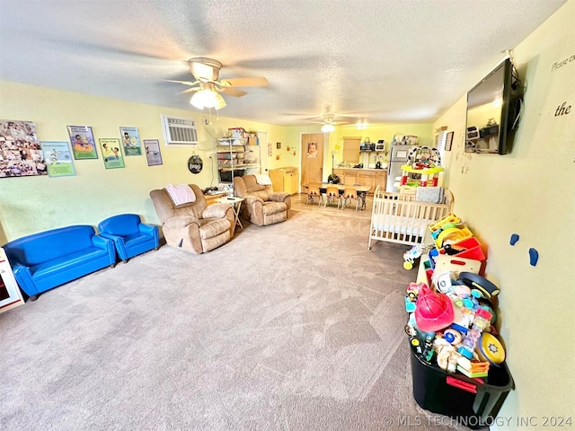 interior space with carpet flooring, ceiling fan, and a textured ceiling