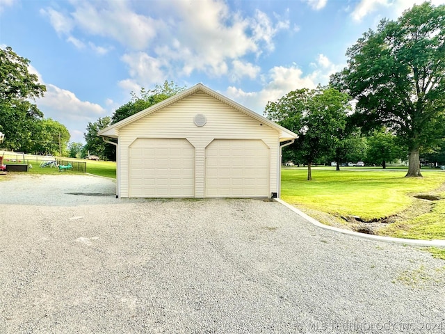 garage with a yard