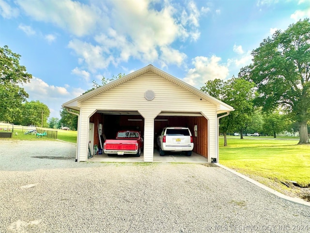 garage with a lawn