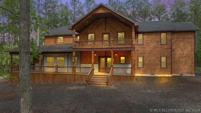 view of front of home with a balcony