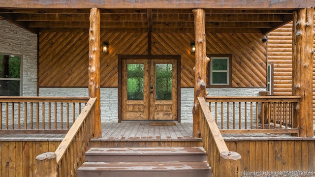 entrance to property featuring a deck