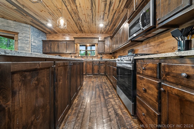 kitchen with stainless steel appliances, wooden ceiling, dark hardwood / wood-style floors, and a healthy amount of sunlight