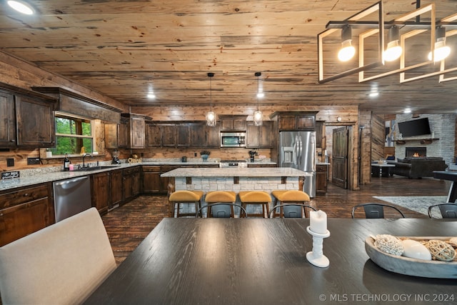 dining room with wooden ceiling, sink, and dark hardwood / wood-style floors