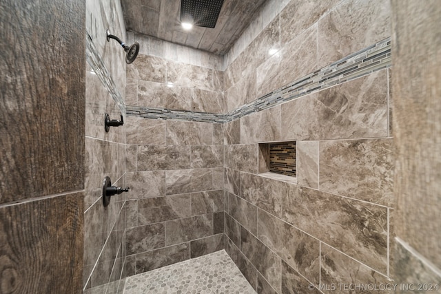 interior space with a tile shower