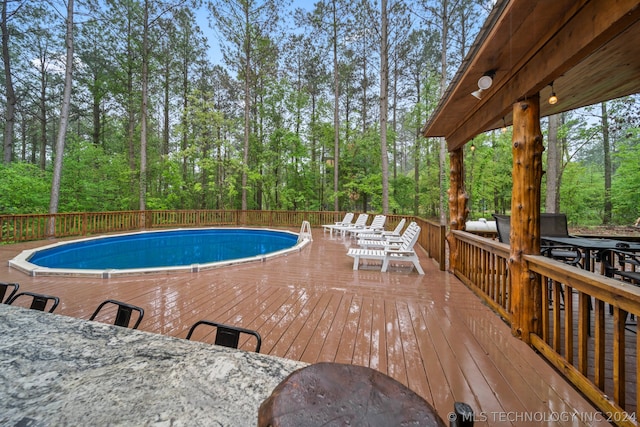 view of pool with a deck