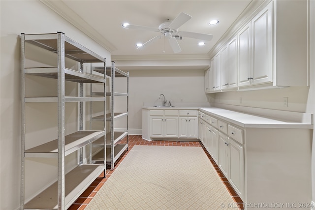 interior space with ceiling fan and sink