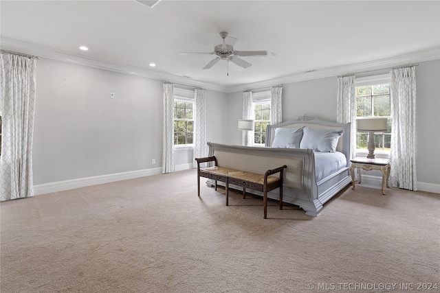 bedroom with ornamental molding, ceiling fan, and carpet floors