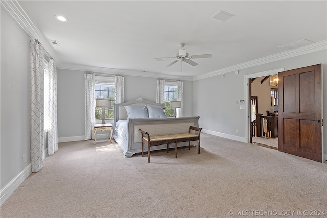 bedroom with ornamental molding, ceiling fan, and light colored carpet