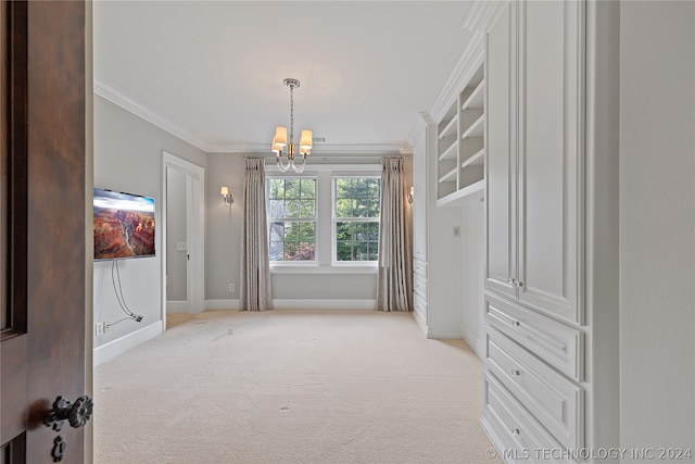 spacious closet with light carpet and a chandelier