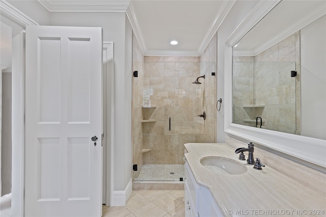 bathroom featuring tile flooring, crown molding, a shower with shower door, and vanity