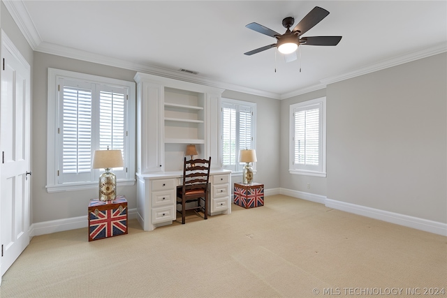 carpeted office space featuring ceiling fan and crown molding