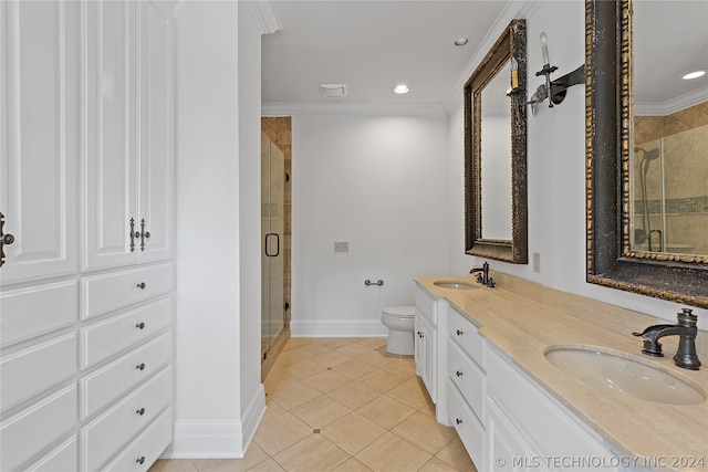 bathroom featuring dual sinks, tile flooring, ornamental molding, toilet, and large vanity