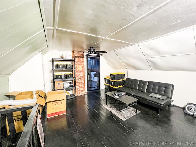 living room featuring brick wall, ceiling fan, hardwood / wood-style flooring, and lofted ceiling