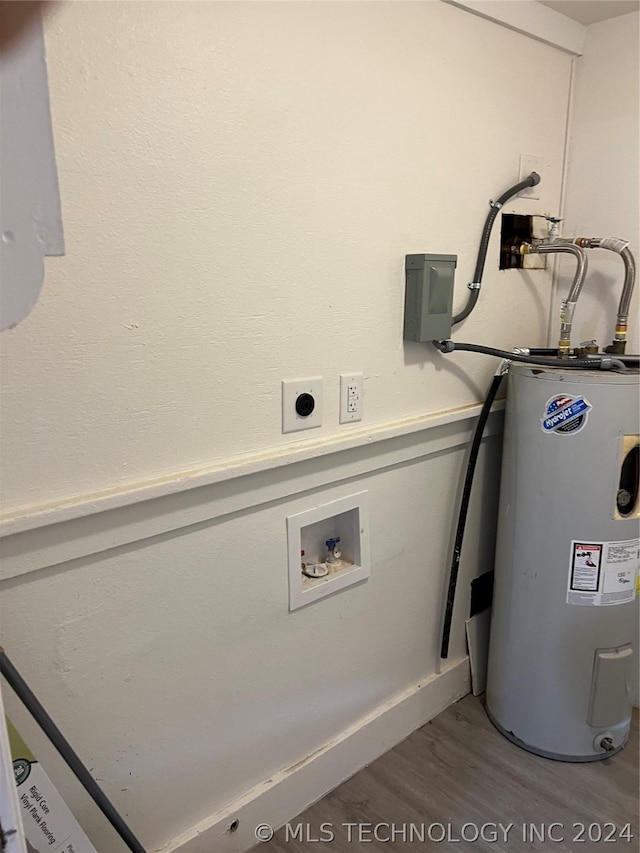 utility room with electric water heater