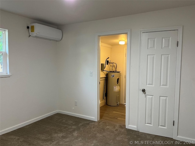 interior space featuring a wall mounted AC and electric water heater