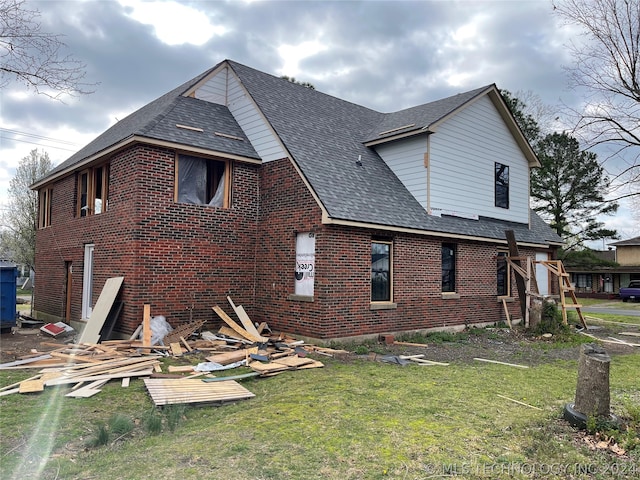 rear view of house with a yard