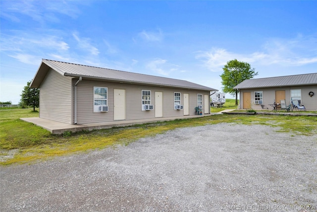 ranch-style home featuring cooling unit