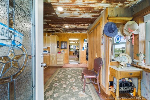 interior space featuring wooden walls