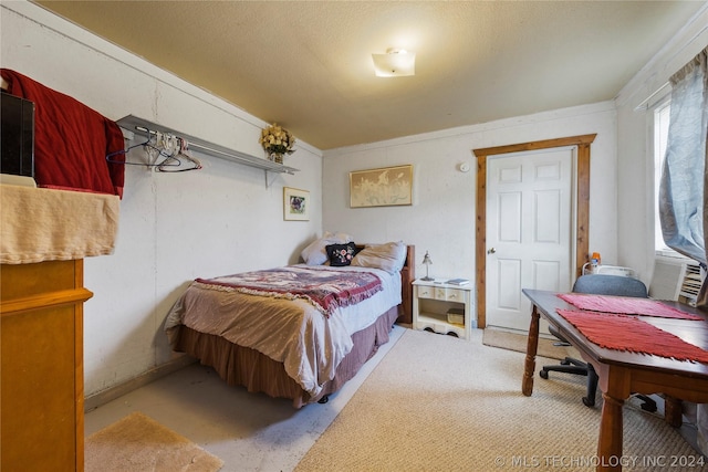 bedroom featuring light carpet