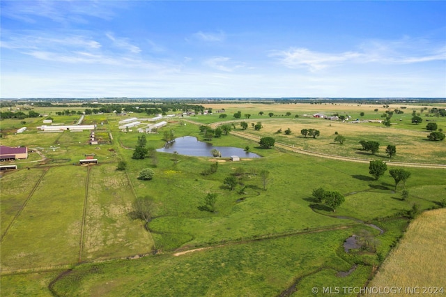 aerial view with a rural view and a water view