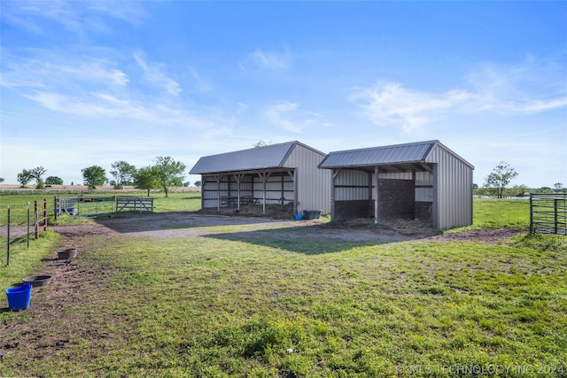 view of outbuilding featuring a rural view