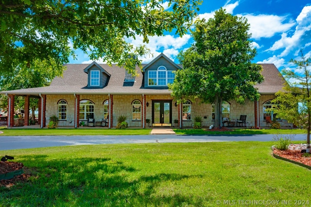 view of front of home with a front lawn and a porch