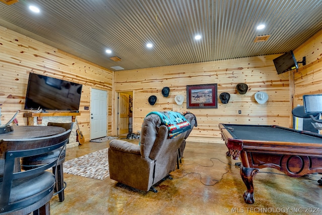 rec room featuring wooden walls, billiards, and concrete flooring