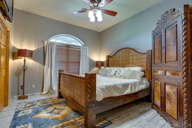 bedroom featuring ceiling fan and light hardwood / wood-style flooring