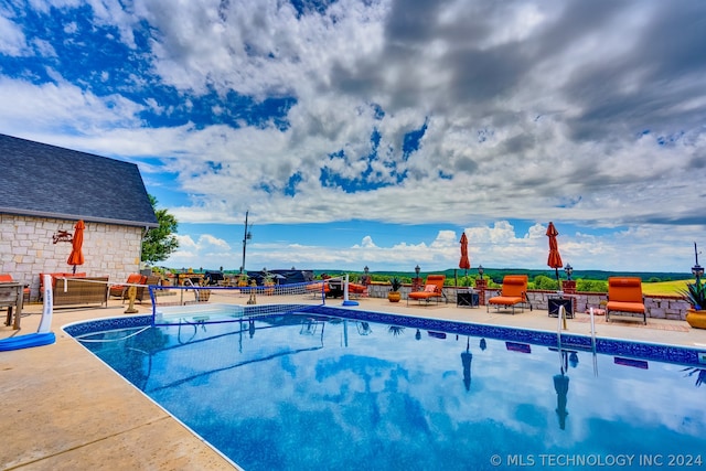 view of pool featuring a patio area