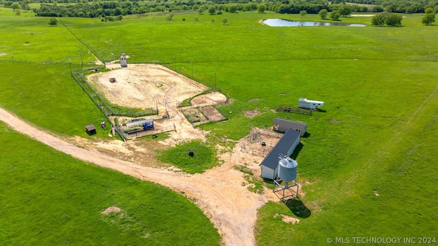 aerial view with a rural view and a water view