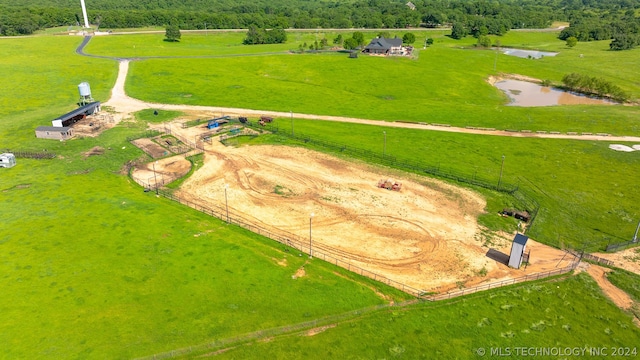 aerial view with a rural view and a water view