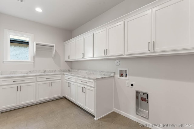 laundry room with washer hookup, cabinets, and hookup for an electric dryer