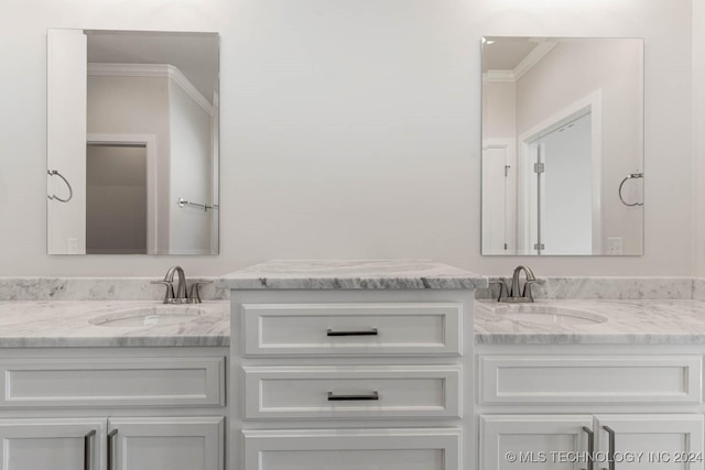 bathroom with vanity and crown molding