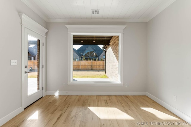 spare room with ornamental molding, wood ceiling, and light hardwood / wood-style flooring