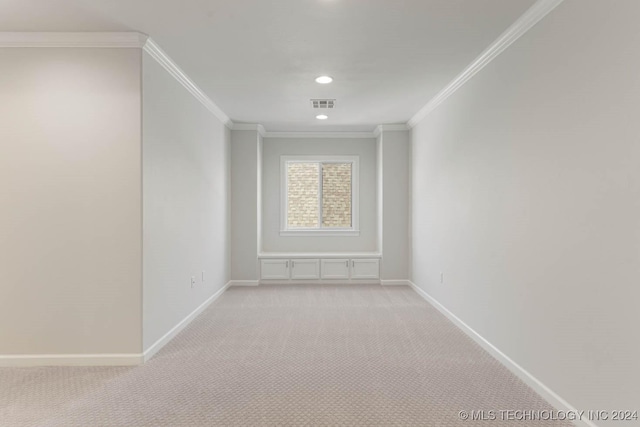 carpeted empty room with ornamental molding