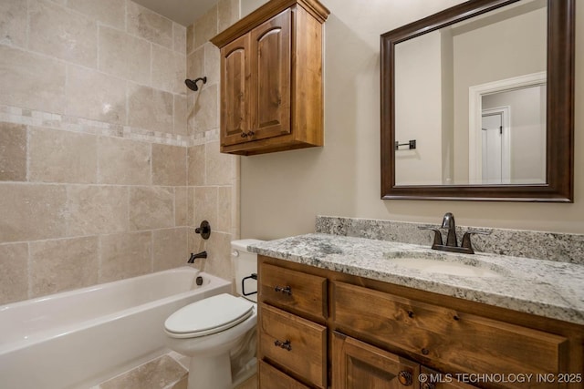 full bathroom with vanity, toilet, and tiled shower / bath combo