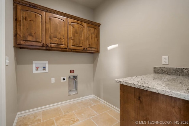 washroom with cabinets, washer hookup, and hookup for an electric dryer