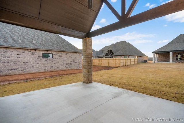 view of patio / terrace featuring fence