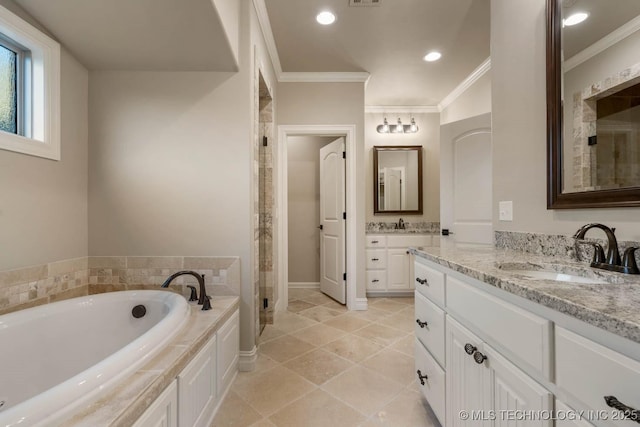 bathroom with vanity, ornamental molding, and shower with separate bathtub