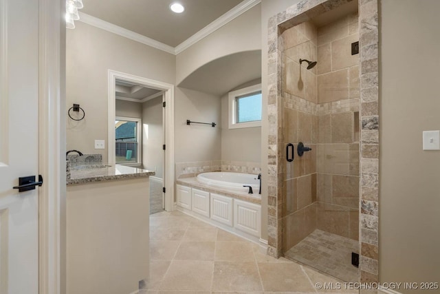 bathroom featuring tile patterned flooring, ornamental molding, independent shower and bath, and sink