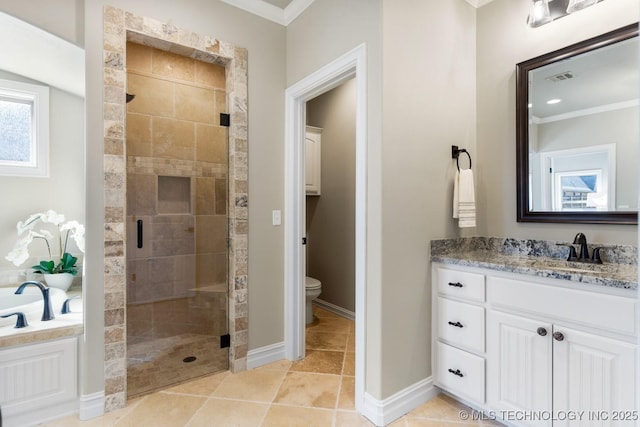 full bathroom featuring toilet, vanity, visible vents, baseboards, and a stall shower