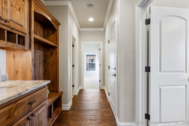 mudroom with recessed lighting, dark wood-type flooring, visible vents, baseboards, and crown molding