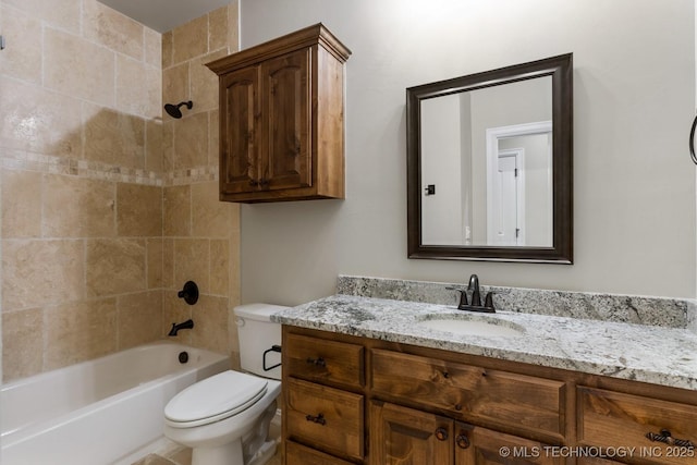 bathroom featuring toilet, vanity, and shower / tub combination