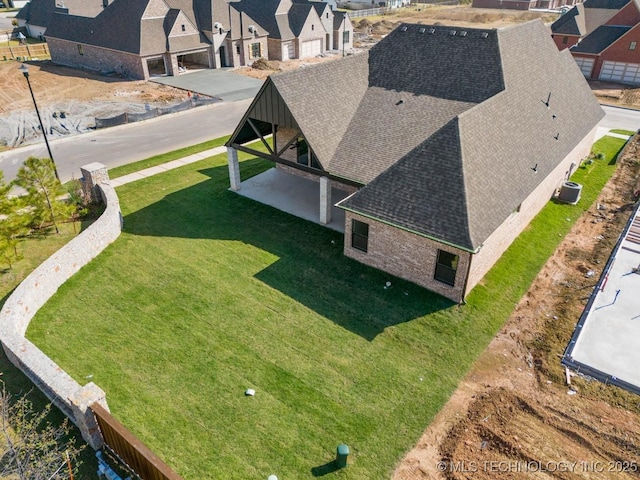 birds eye view of property with a residential view